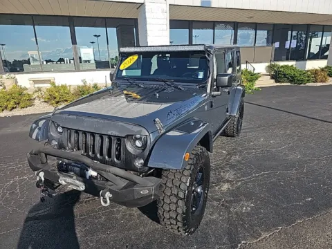 Gray 2016 Jeep Wrangler Unlimited Sahara for sale in Muncie, IN