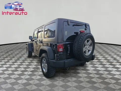 Another view of 2012 Jeep Wrangler Unlimited Rubicon Sport Utility 4D for sale in Plainville, MA at Interauto