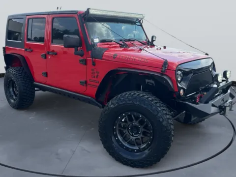 Red 2016 Jeep Wrangler Unlimited Sport S for sale in Blytheville, AR