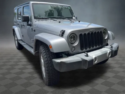 Another view of 2014 Jeep Wrangler Unlimited Sahara for sale in Colorado Springs, CO at McCloskey Imports & 4x4s