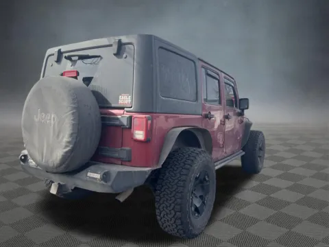 Another view of 2013 Jeep Wrangler Unlimited Sahara for sale in Colorado Springs, CO at McCloskey Truck Town (Licensed as McCloskey Motors Inc.)