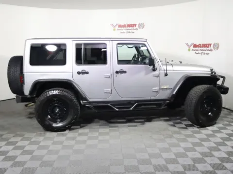 Another view of 2014 Jeep Wrangler Unlimited Sahara for sale in Colorado Springs, CO at McCloskey Truck Town (Licensed as McCloskey Motors Inc.)