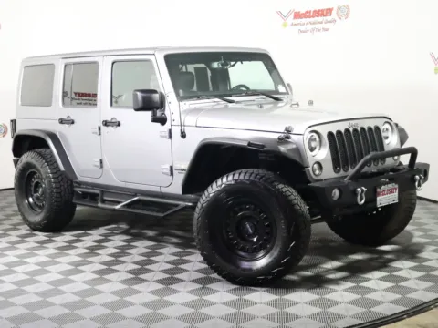Photos of 2014 Jeep Wrangler Unlimited Sahara for sale in Colorado Springs, CO at McCloskey Truck Town (Licensed as McCloskey Motors Inc.)