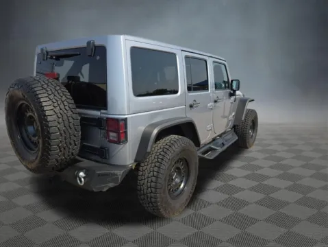 Another view of 2014 Jeep Wrangler Unlimited Sahara for sale in Colorado Springs, CO at McCloskey Truck Town (Licensed as McCloskey Motors Inc.)