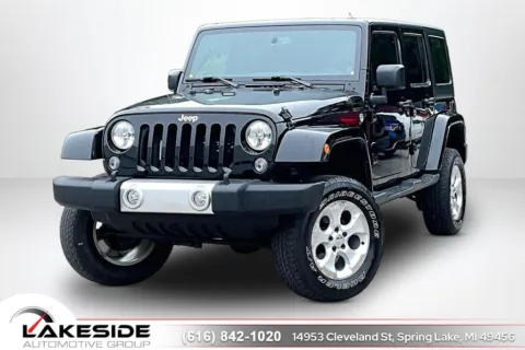 Black 2014 Jeep Wrangler Unlimited Sahara for sale in Spring Lake, MI