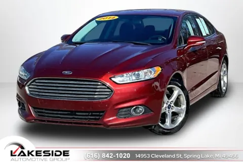 Orange 2014 Ford Fusion SE for sale in Spring Lake, MI