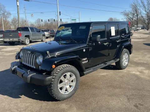 Black 2016 JEEP WRANGLER UNLIMI SAHARA for sale in Camby, IN