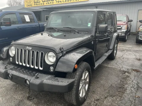Black 2016 JEEP WRANGLER UNLIMI SAHARA for sale in Camby, IN