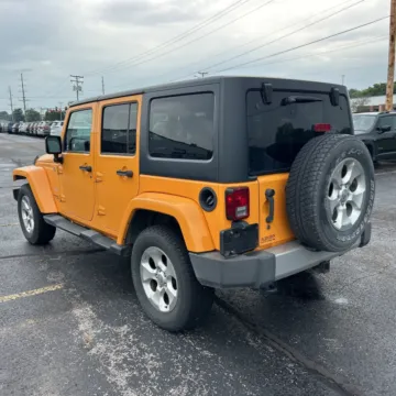 Photos of 2013 Jeep Wrangler Unlimited Sahara for sale in Camby, IN at Mr. Care Auto