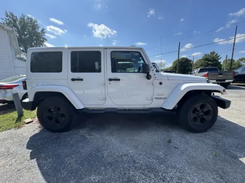 Photos of 2015 JEEP WRANGLER UNLIMI SAHARA for sale in Camby, IN at Mr. Care Auto