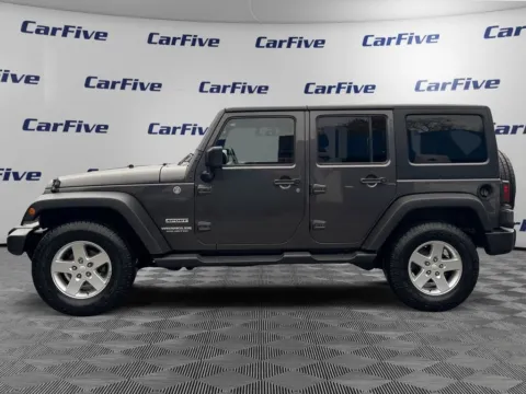 Photos of 2014 Jeep Wrangler Unlimited Sport for sale in Nashua, NH at CarFive Nashua, NH
