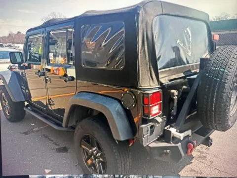 Photos of 2013 Jeep Wrangler Unlimited Sport for sale in Nashua, NH at CarFive Nashua, NH