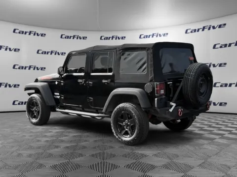 Another view of 2013 Jeep Wrangler Unlimited Sport for sale in Nashua, NH at CarFive Nashua, NH