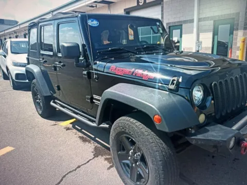 Another view of 2013 Jeep Wrangler Unlimited Sport for sale in Nashua, NH at CarFive Nashua, NH