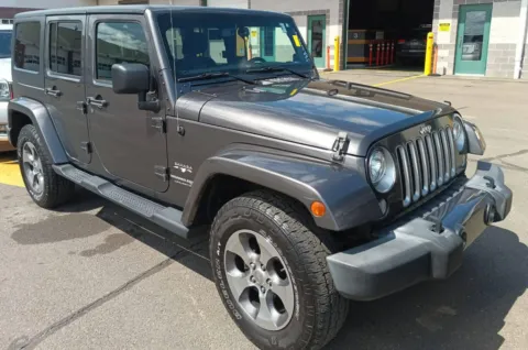Photos of 2018 Jeep Wrangler JK Unlimited Sahara for sale in Nashua, NH at CarFive Nashua, NH