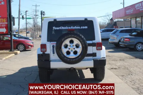 More photos of 2014 Jeep Wrangler Unlimited Sahara at Your Choice Autos - Waukegan, IL
