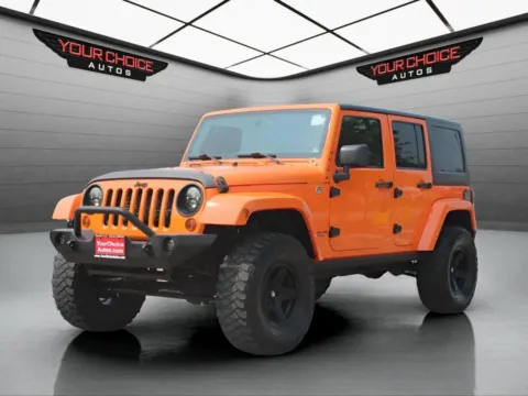 Orange 2012 Jeep Wrangler Unlimited Sahara for sale in Waukegan, IL
