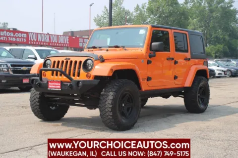 Orange 2012 Jeep Wrangler Unlimited Sahara for sale in Waukegan, IL