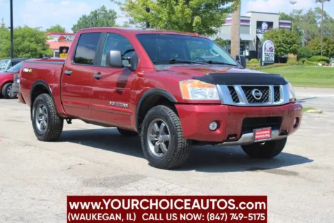 Another view of 2014 Nissan Titan PRO 4X 4x4 4dr Crew Cab SWB Pickup for sale in Waukegan, IL at Your Choice Autos - Waukegan