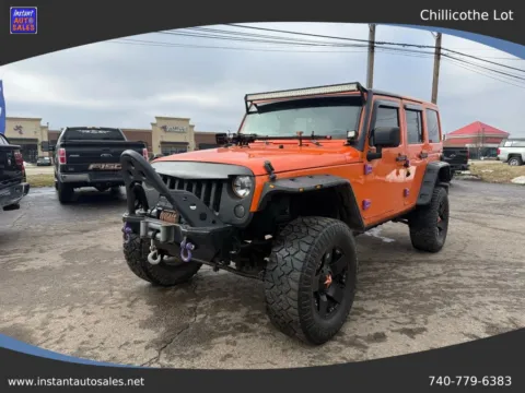 Orange 2012 Jeep Wrangler Unlimited Sahara Sport Utility 4D for sale in Chillicothe, OH