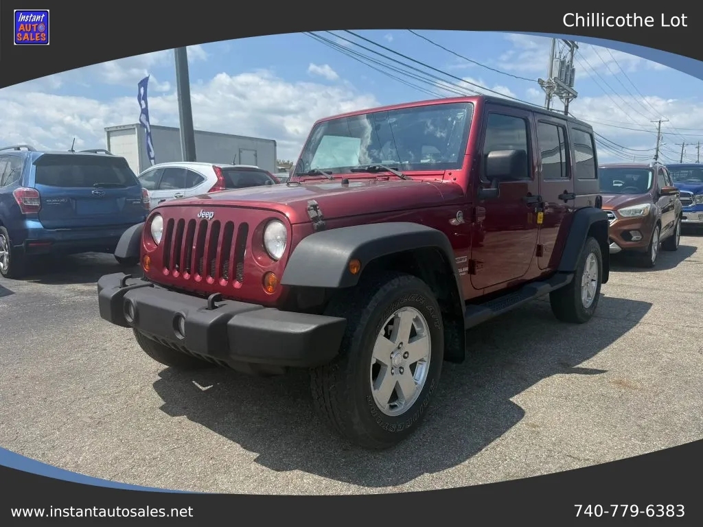 Red 2011 Jeep Wrangler Unlimited Sport SUV 4D for sale in Chillicothe, OH