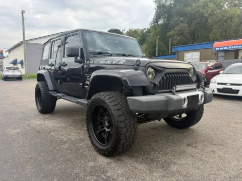 Another view of 2014 Jeep Wrangler Unlimited Sahara Sport Utility 4D for sale in Chillicothe, OH at Instant Auto Sales Chillicothe