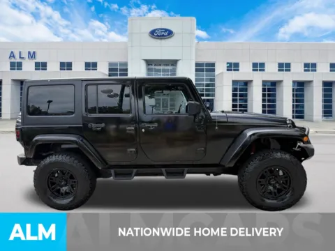 More photos of 2013 Jeep Wrangler Unlimited Sahara at ALM Ford Marietta, GA