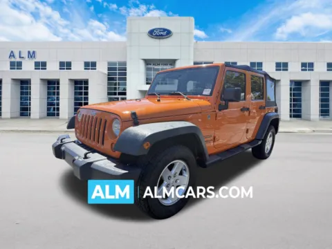 Orange 2013 Jeep Wrangler Unlimited Sport for sale in Marietta, GA