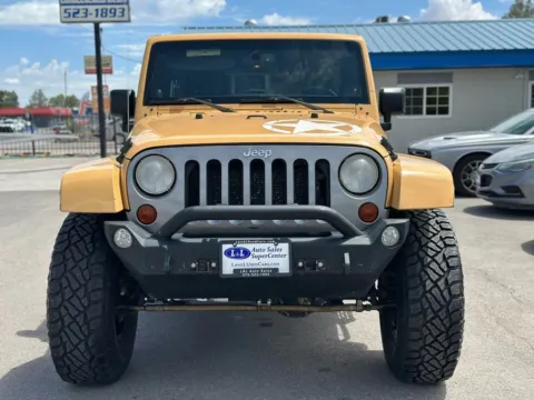 Another view of 2013 Jeep Wrangler Unlimited Sport Freedom Edition Sport Utility 4D for sale in Las Cruces, NM at L&L Auto Sales