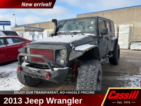 Black 2013 Jeep Wrangler Unlimited Sahara for sale in Cedar Rapids, IA