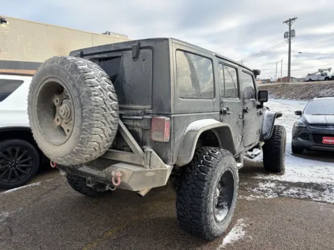 Another view of 2013 Jeep Wrangler Unlimited Sahara for sale in Cedar Rapids, IA at Cassill Motors