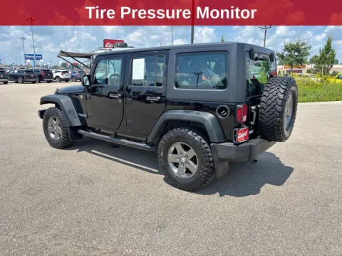 Another view of 2011 Jeep Wrangler Unlimited Sport for sale in Cedar Rapids, IA at Cassill Motors