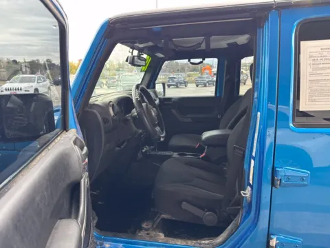 Photos of 2015 Jeep Wrangler Unlimited Sport for sale in Cedar Rapids, IA at Cassill Motors