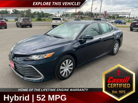 Blue 2021 Toyota Camry Hybrid LE for sale in Cedar Rapids, IA