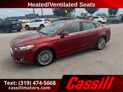 Orange 2014 Ford Fusion Titanium for sale in Cedar Rapids, IA
