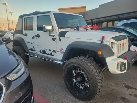 Photos of 2013 Jeep Wrangler Unlimited Sport for sale in Cedar Rapids, IA at Cassill Motors