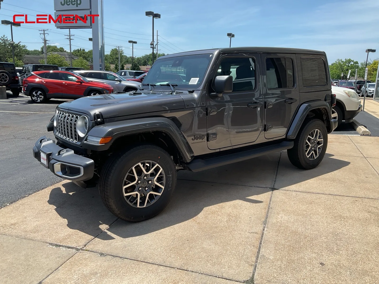 Gray 2025 Jeep Wrangler Sahara for sale in Florissant, MO