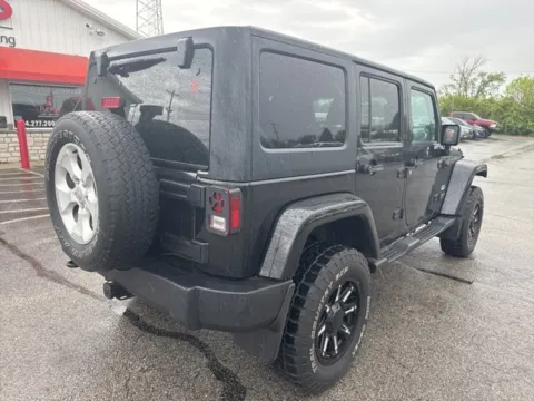 Another view of 2013 Jeep Wrangler Unlimited Sahara for sale in Grove City, OH at Funky's Automotive - A division of ETC Auto Group