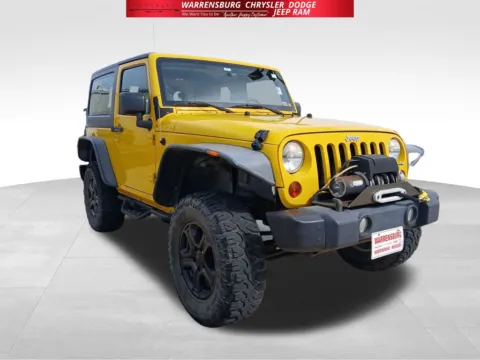 Yellow 2011 Jeep Wrangler Sport for sale in Warrensburg, MO