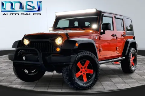 Orange 2015 Jeep Wrangler Unlimited Sport S for sale in Jacksonville, FL
