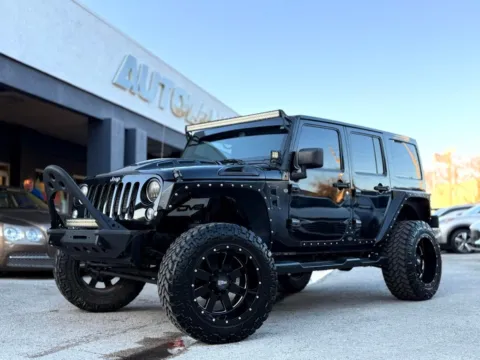 Black 2014 Jeep Wrangler Unlimited Sahara for sale in Jacksonville, FL