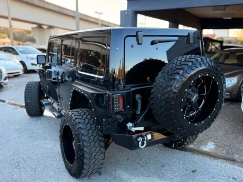 More photos of 2014 Jeep Wrangler Unlimited Sahara at AUTOLAND, FL