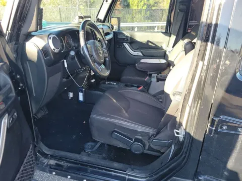 Another view of 2014 Jeep Wrangler Unlimited Sahara for sale in Jacksonville, FL at AUTOLAND