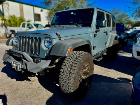 Gray 2015 Jeep Wrangler Unlimited Sport for sale in Jacksonville, FL