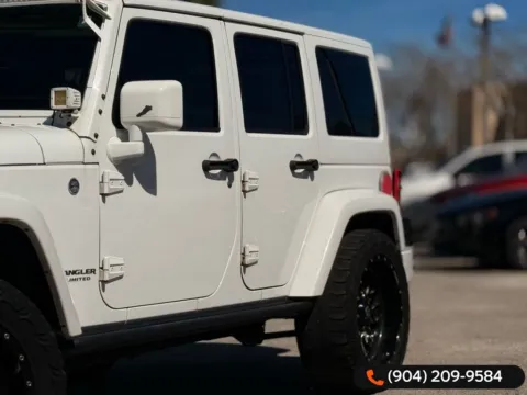 Another view of 2015 Jeep Wrangler Unlimited Sahara Altitude for sale in Jacksonville, FL at AUTOLAND