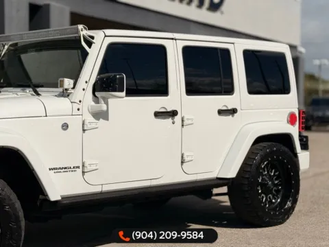 Another view of 2015 Jeep Wrangler Unlimited Sahara Altitude for sale in Jacksonville, FL at AUTOLAND