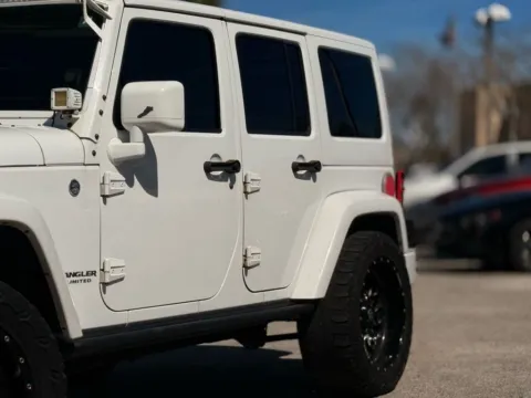 Another view of 2015 Jeep Wrangler Unlimited Sahara Altitude for sale in Jacksonville, FL at AUTOLAND