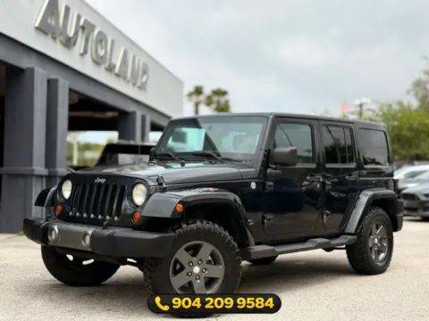 Black 2011 Jeep Wrangler Unlimited Sport S for sale in Jacksonville, FL