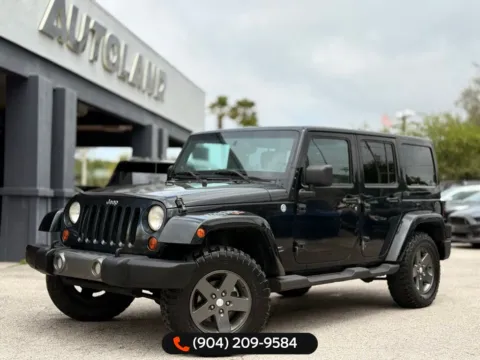 Black 2011 Jeep Wrangler Unlimited Sport S for sale in Jacksonville, FL