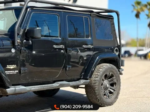 Another view of 2015 Jeep Wrangler Unlimited Sahara for sale in Jacksonville, FL at AUTOLAND